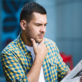 A Man Looking at a Document